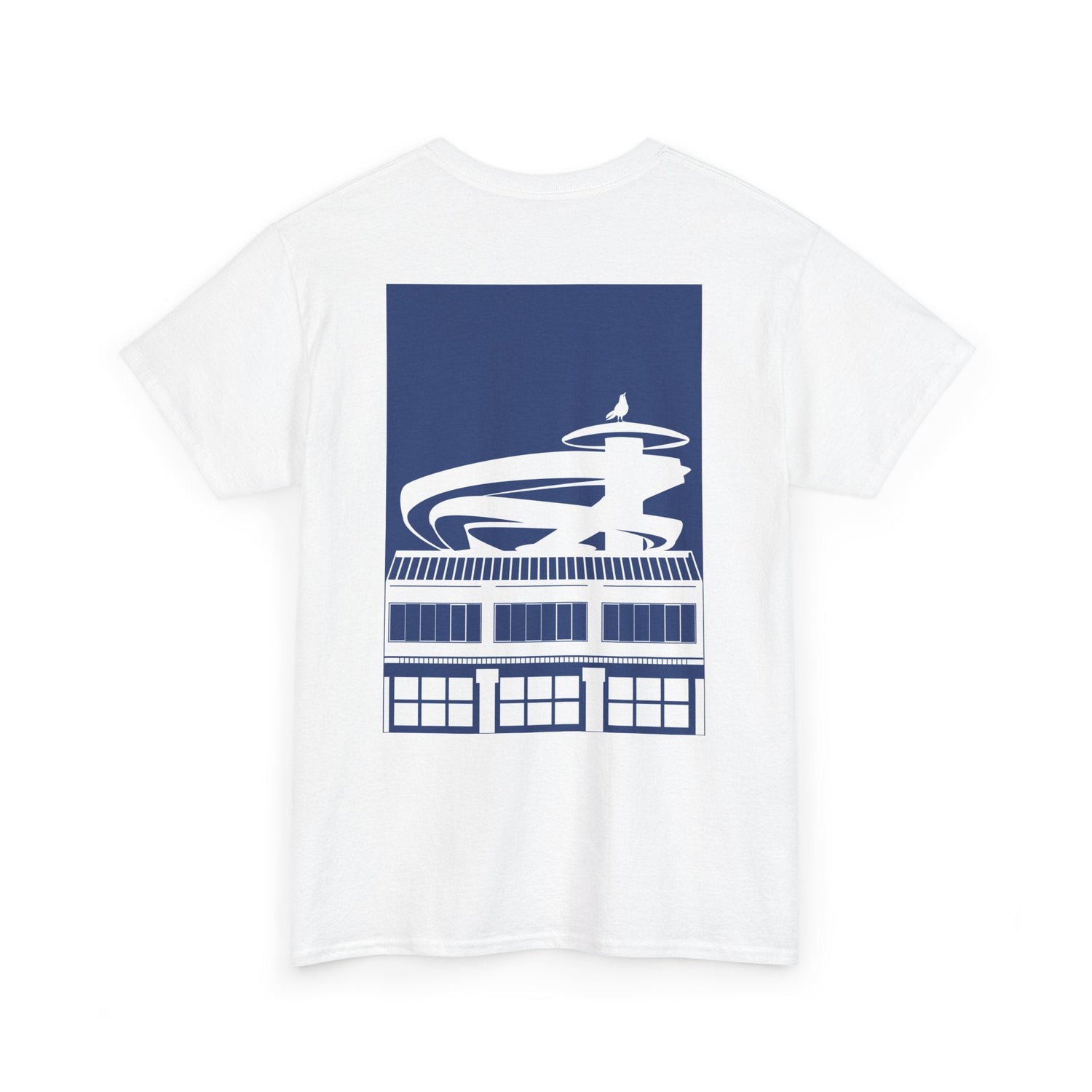 White T-shirt with a blue graphic of a building topped by a spiral tower and bird silhouette.
